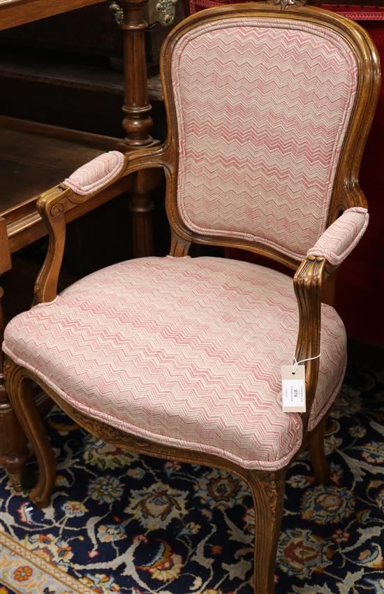 A French beech upholstered elbow chair